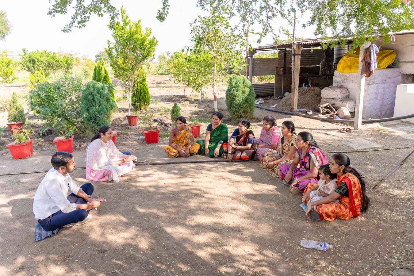 People seated in a circle for a community conversation